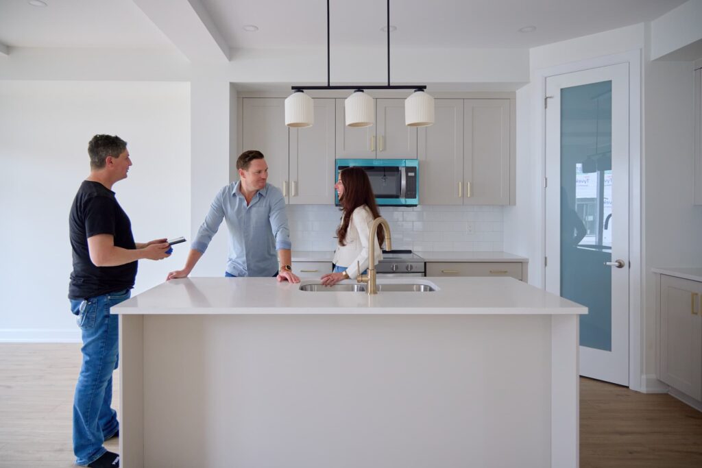 Couple talking to gleenview Associate in kitchen